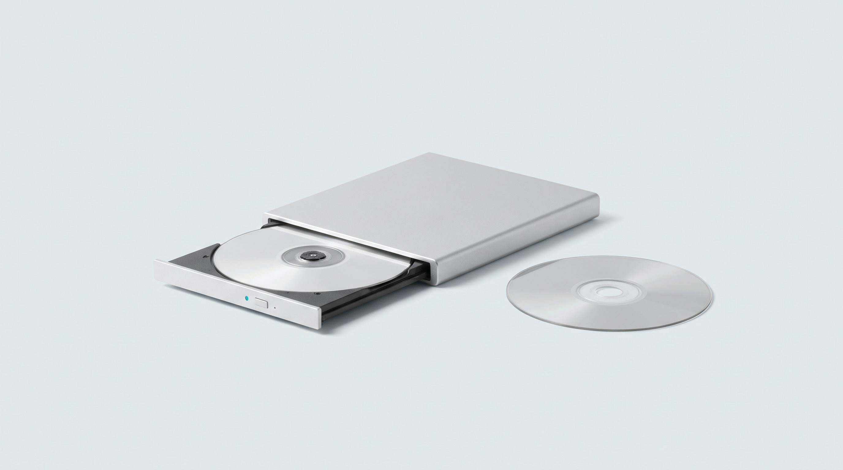 Lecteur optique externe tiroir ouvert avec un disque vierge, second disque posé à côté
