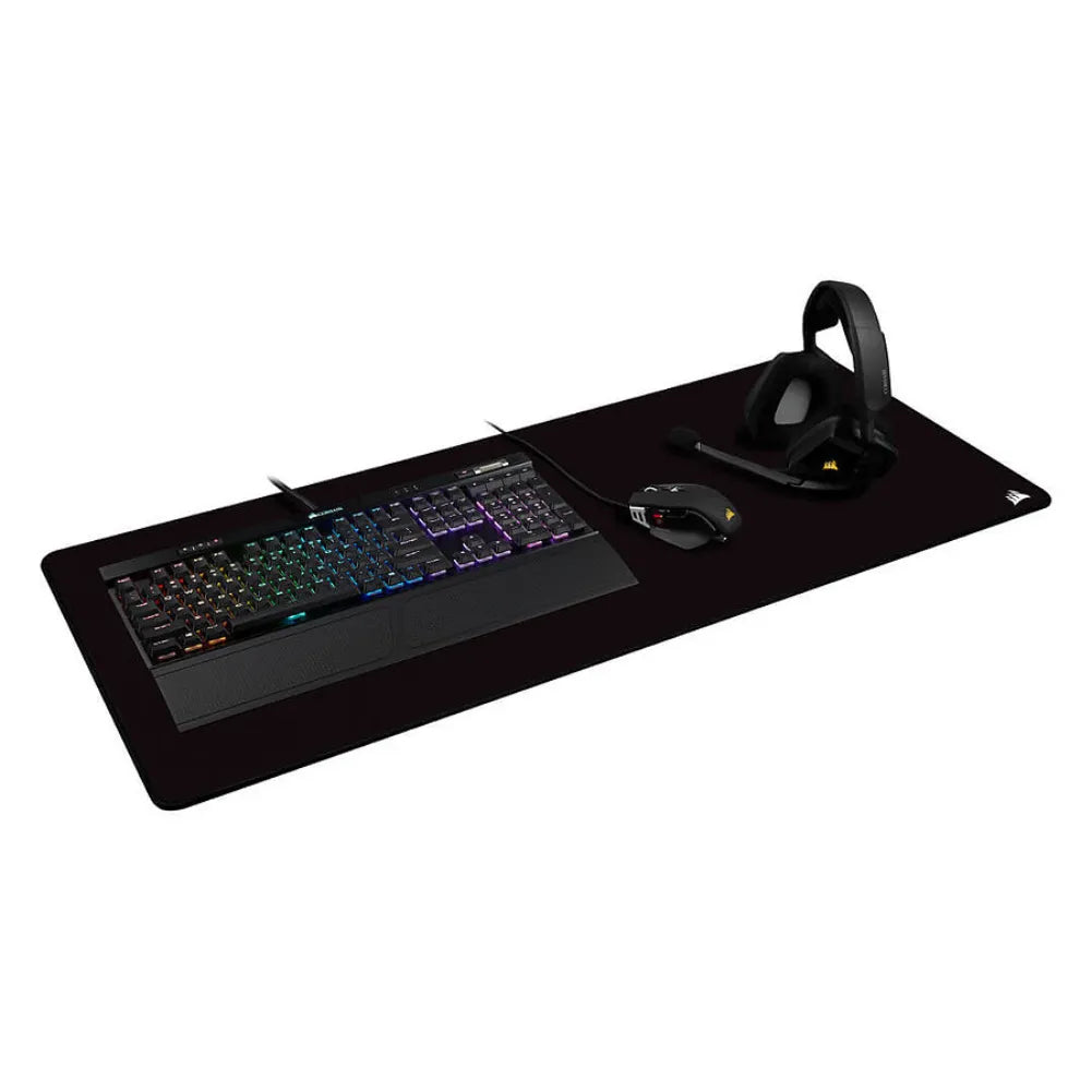 Corsair MM350 Pro XXL gaming mouse pad with RGB keyboard, gaming mouse, and headset.