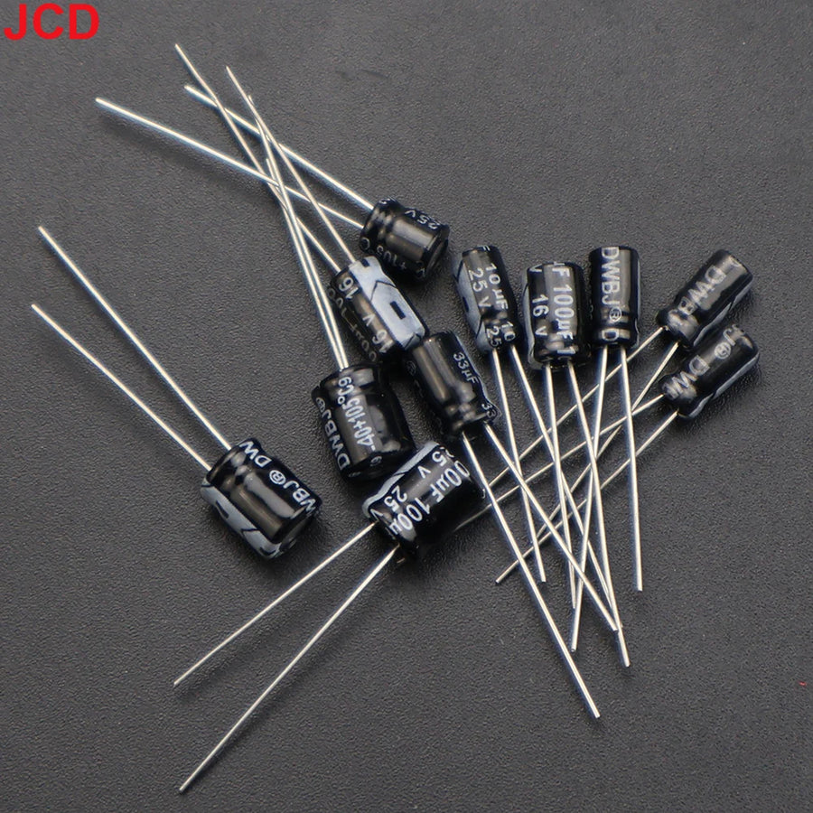 Through-hole capacitors and inductor from the JCD kit for Game Boy DMG