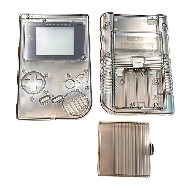 Coque complète pour Game Boy DMG avec ses boutons et pads caoutchouc, pièces présentées à plat