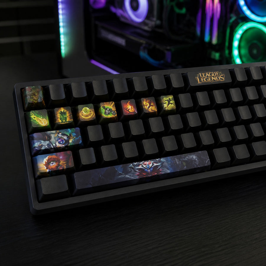 Ivern keycaps fitted on a black mechanical keyboard in front of a gaming PC