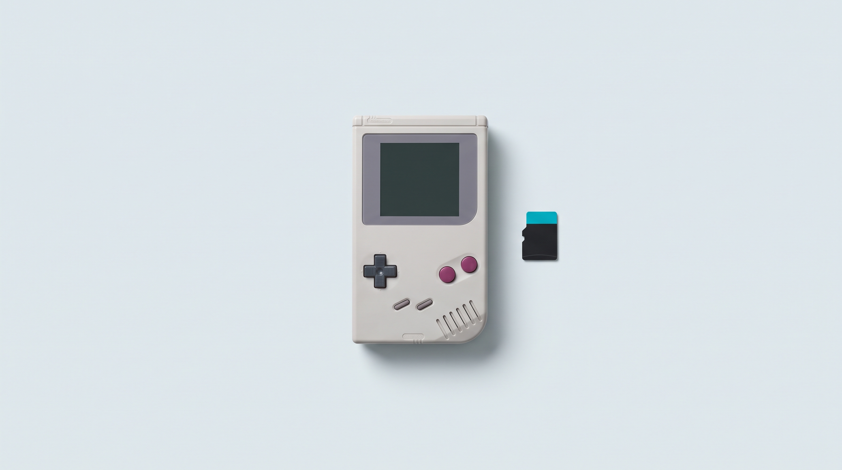 Console portable rétro posée à plat, carte microSD laissée intacte à distance