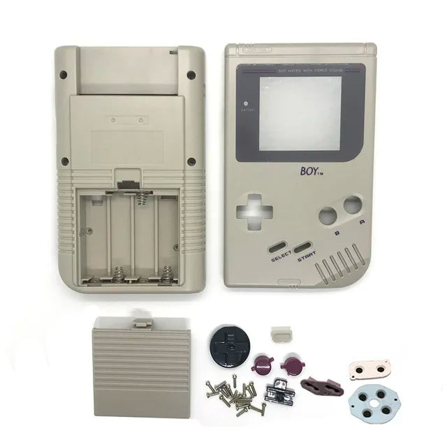 Coque complète Game Boy DMG grise, façade, dos, cache-piles, boutons et pads présentés à plat