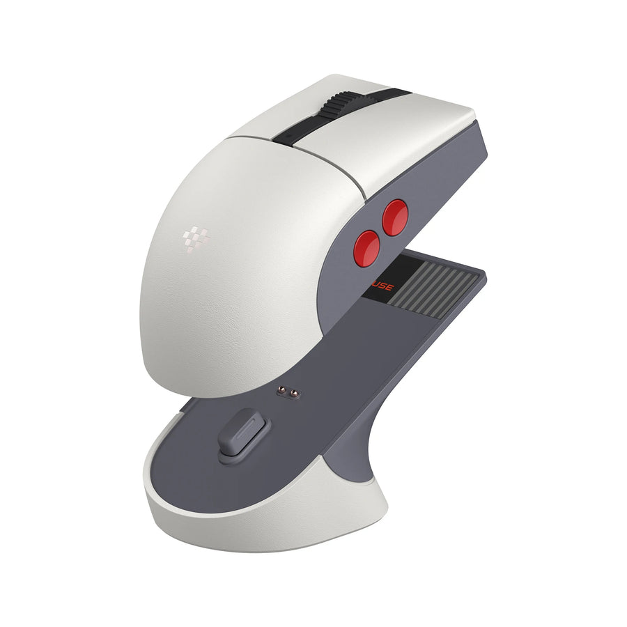 8BitDo Retro R8 N Edition mouse in grey and white resting on its charging dock