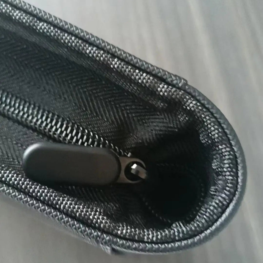 Close-up of the rounded corner and zip pull of the Homefish binder