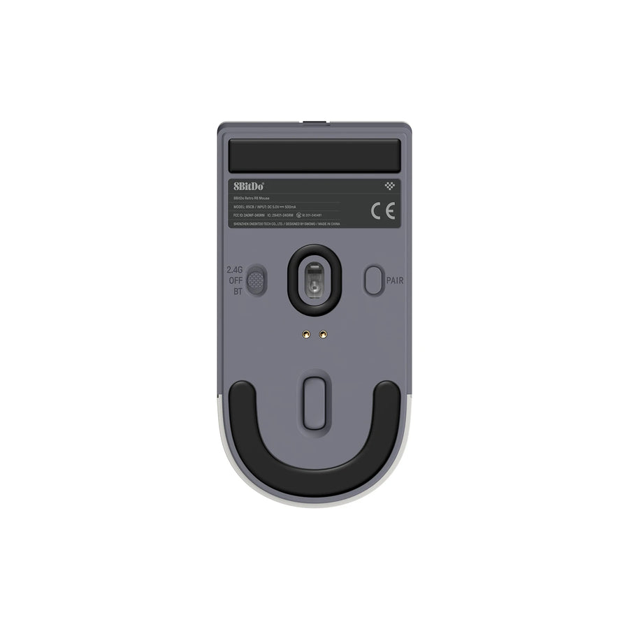 Underside of the 8BitDo Retro R8 mouse: optical sensor and glide feet