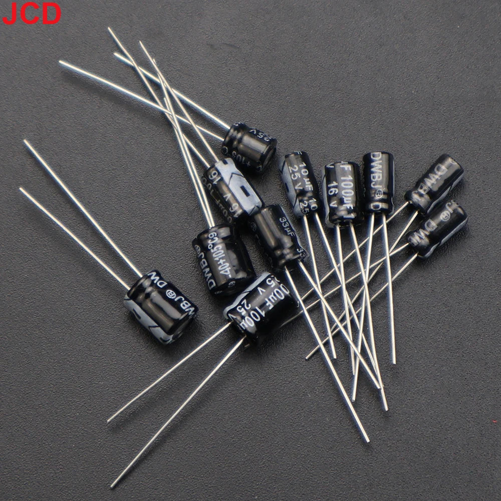 Through-hole capacitors and inductor from the JCD kit for Game Boy DMG